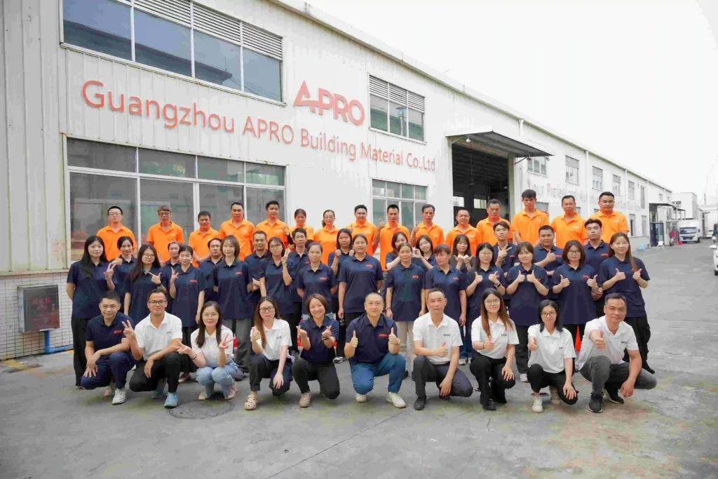 APRO team gathered outside company building for a group photo scaled