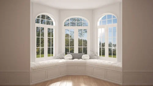 Interior bay window seat with white cushions