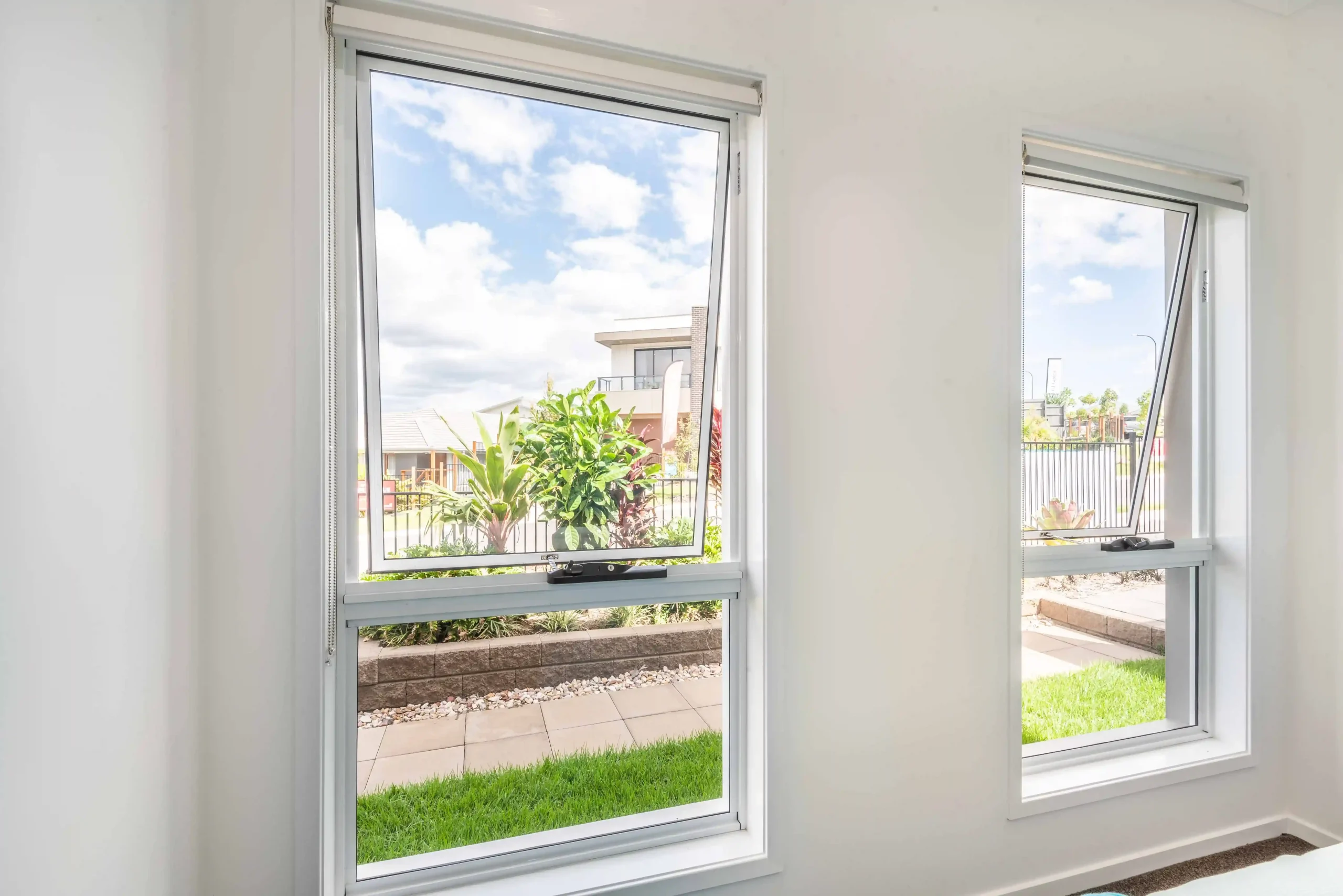 White awning windows paired with fixed panes in bright room