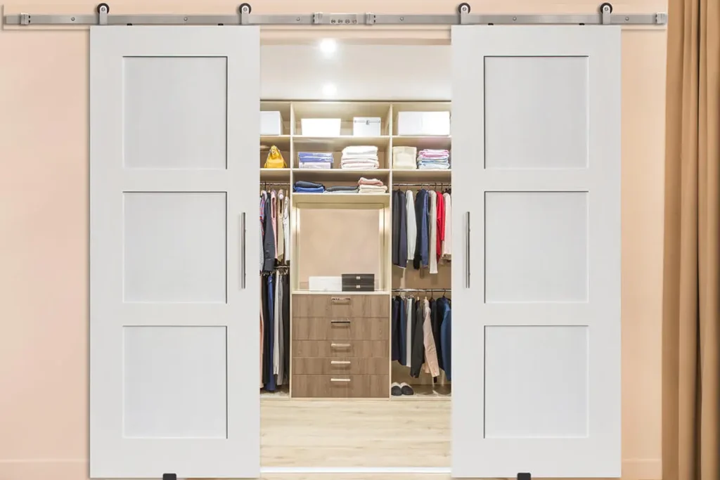 Barn door with modern wardrobe inside