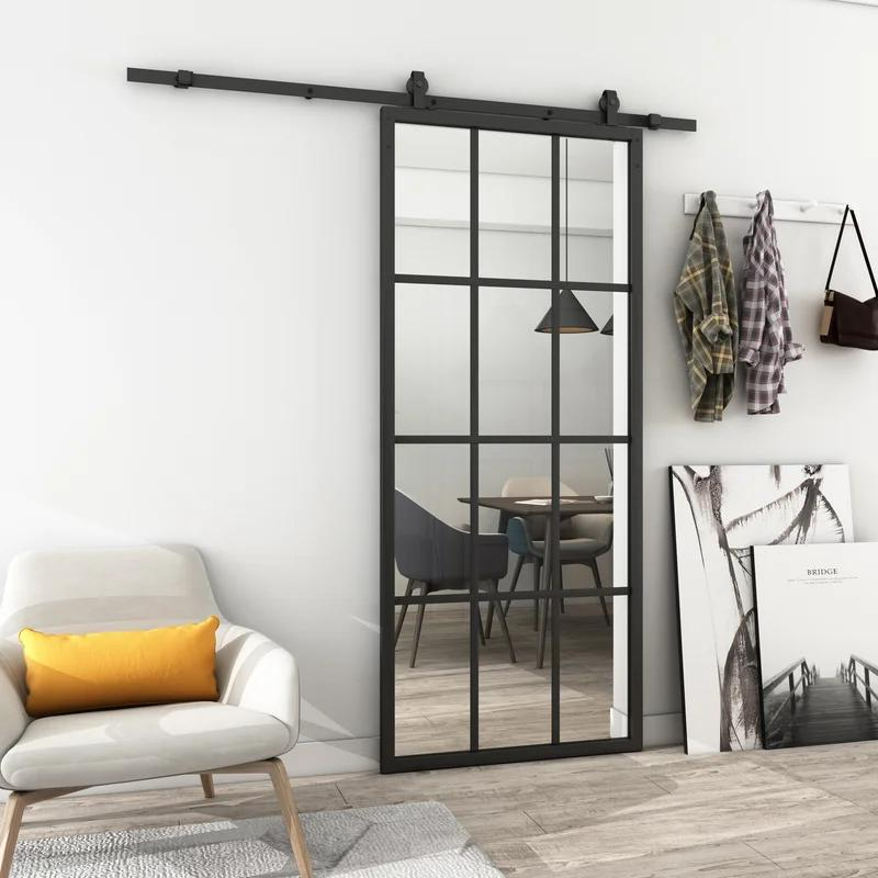 Black framed glass barn door for dining space