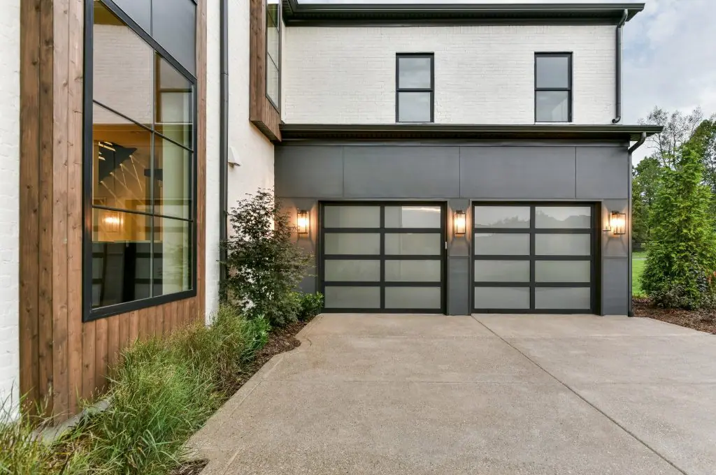 Double frosted glass garage doors on modern home