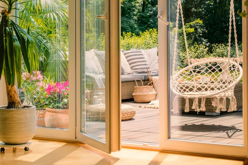 Fiberglass patio doors with tropical deck setting