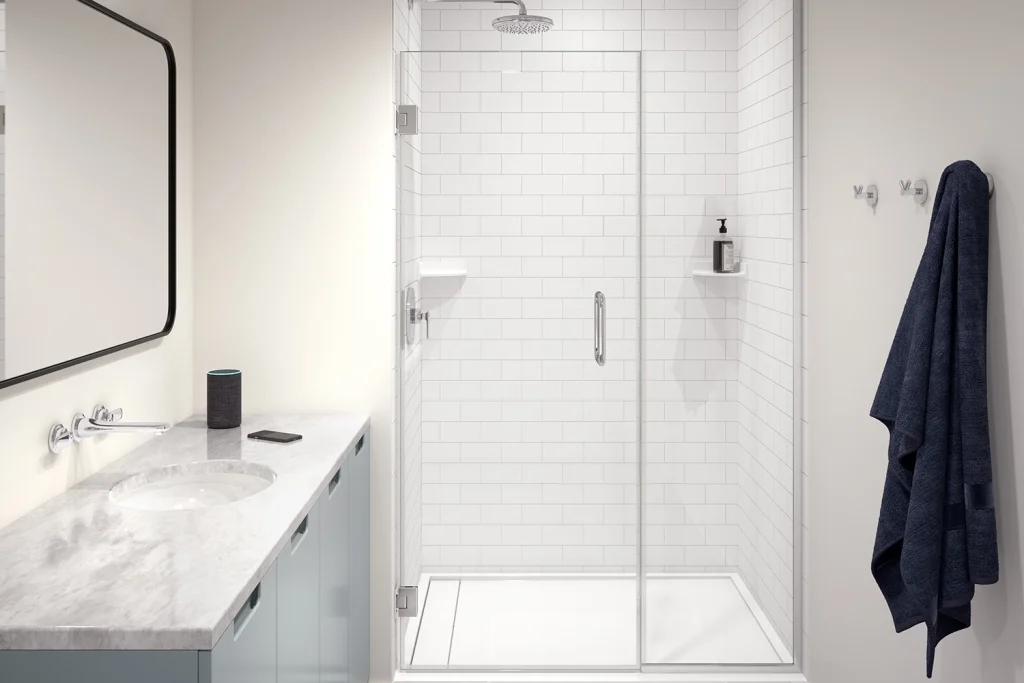 Spazio di ospitalità con porta doccia in vetro con cerniera