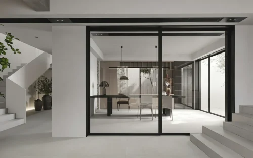 Minimalist home office with black framed glass doors