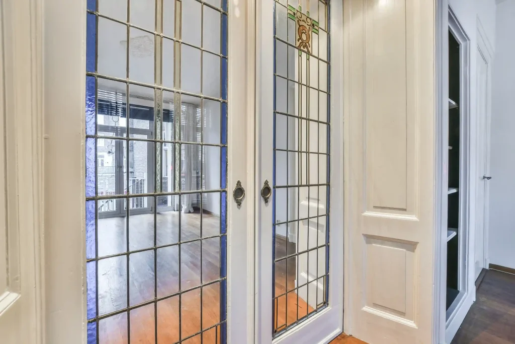 White French doors with grid style glass panels