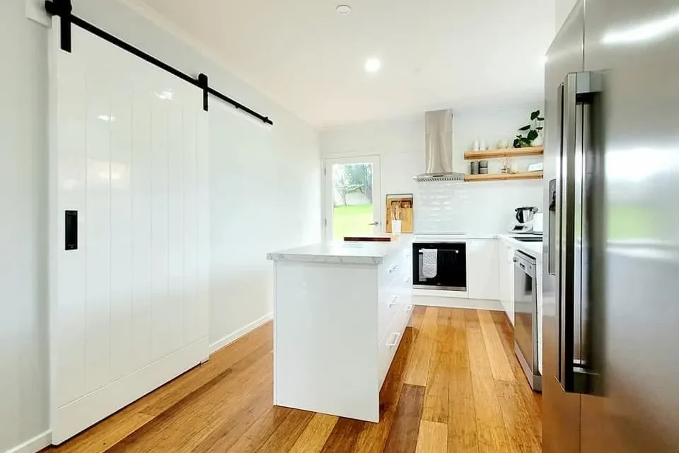 White barn door sliding in modern kitchen