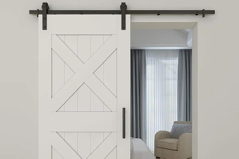 White wood barn door for bedroom entry