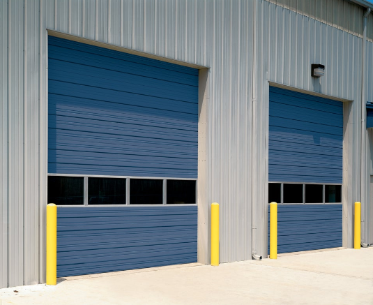 Blue overhead garage doors with window panels installed