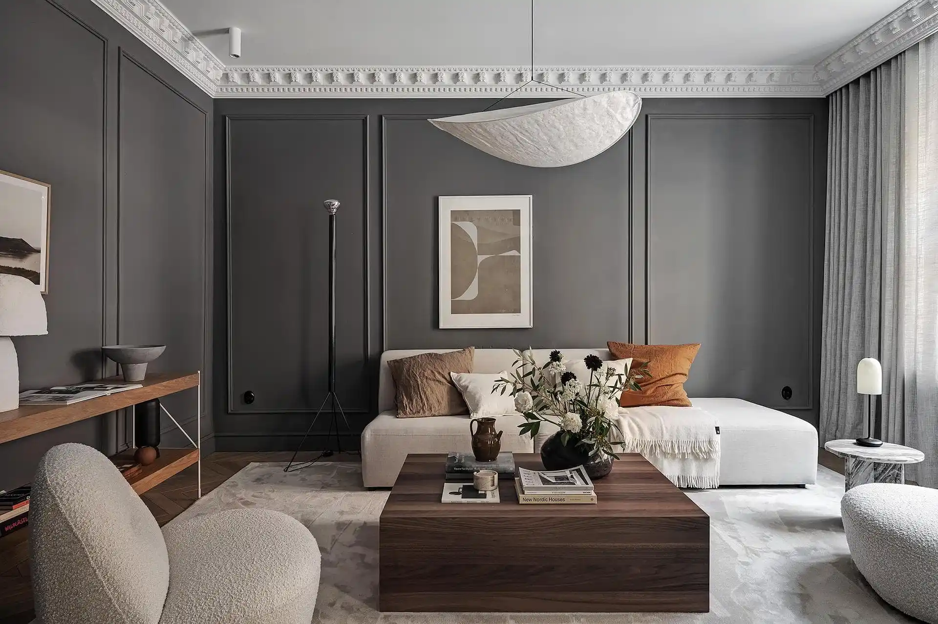 Charcoal wall with white trim and cozy decor