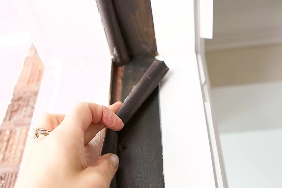 Inspecting and removing old weatherstrip material