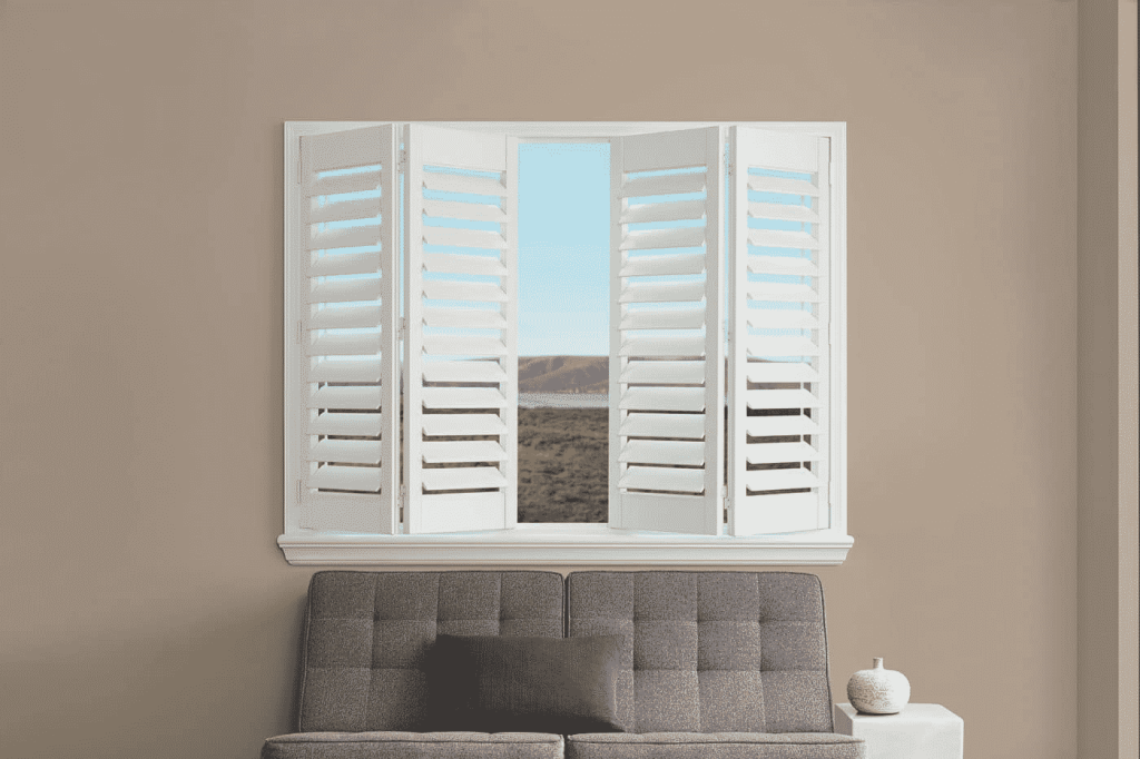 Bifold window shutters framing scenic outdoor landscape