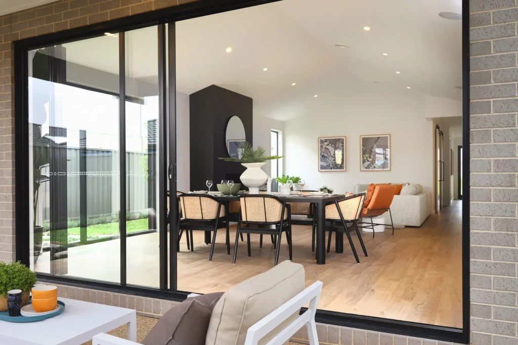 Stacking sliding doors opening dining area to patio