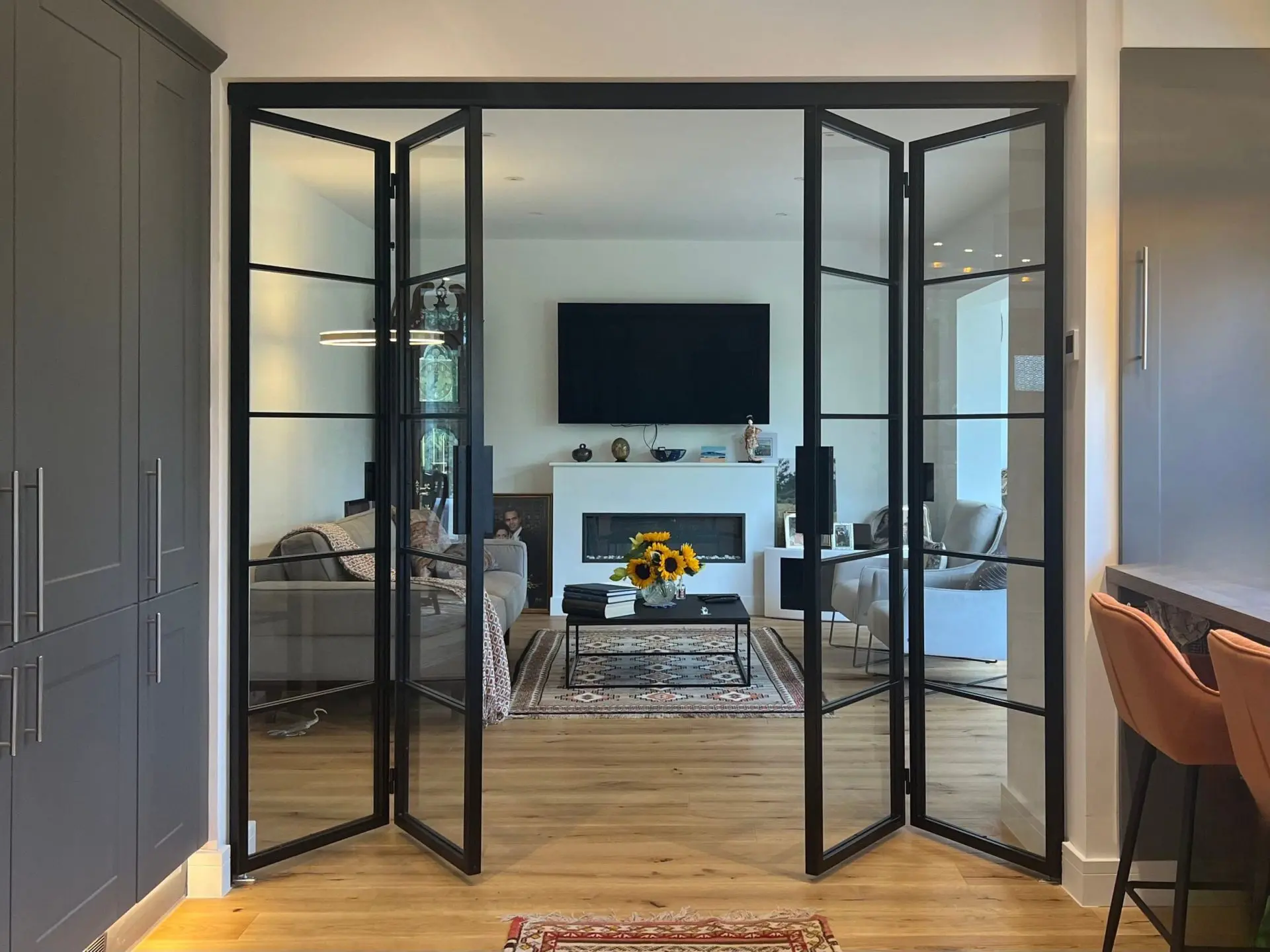 Black Glass Windows Paired with Black Doors for Continuity Black Glass Window Design