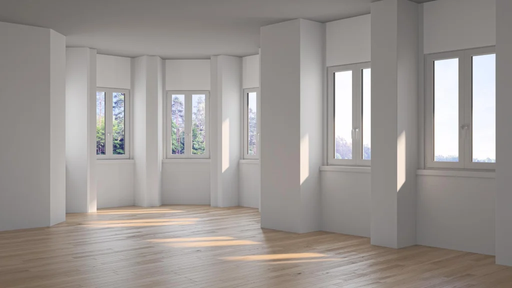 Habitación luminosa con múltiples ventanas abatibles modernas.