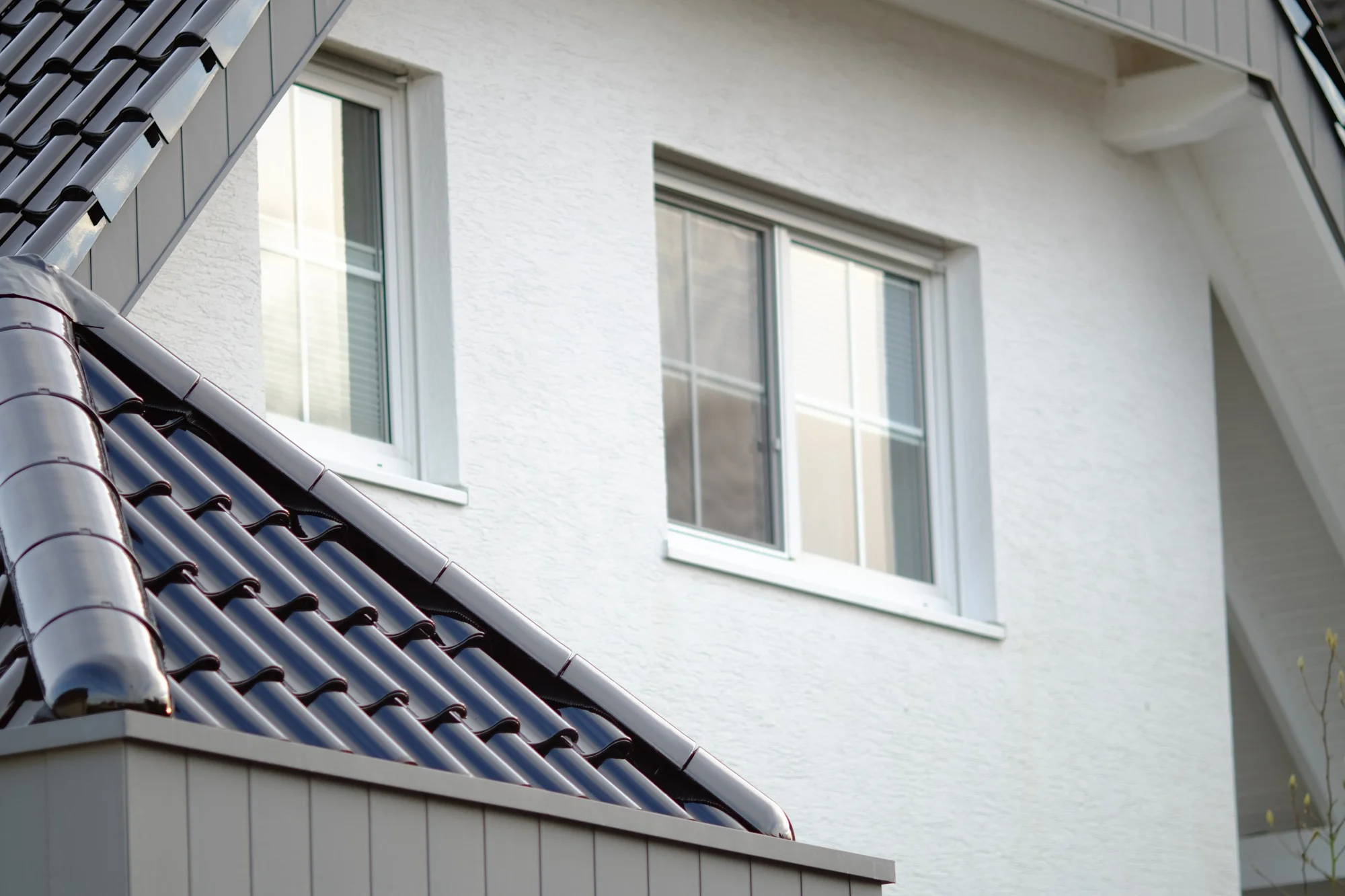 Casement windows providing ventilation on house exterior