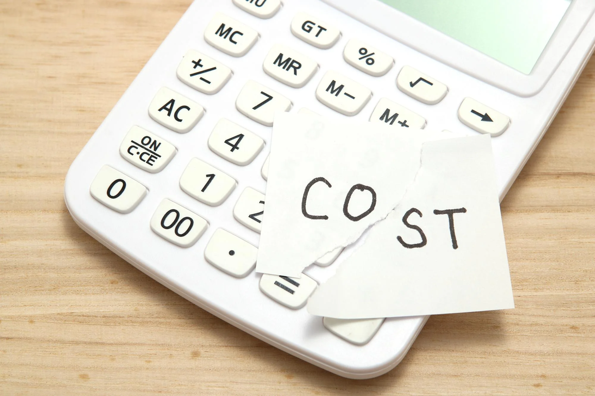 Cost note on calculator showing window project budgeting