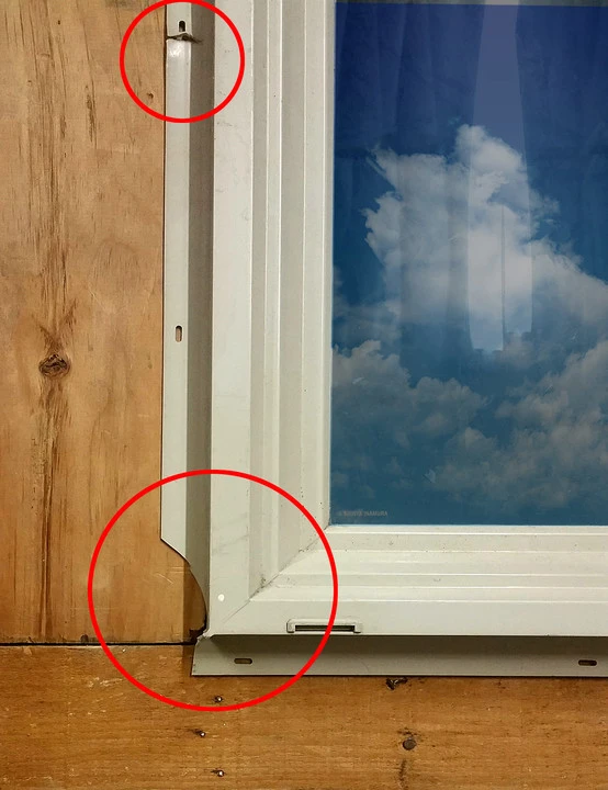 Installed window with nail fin secured to wall sheathing