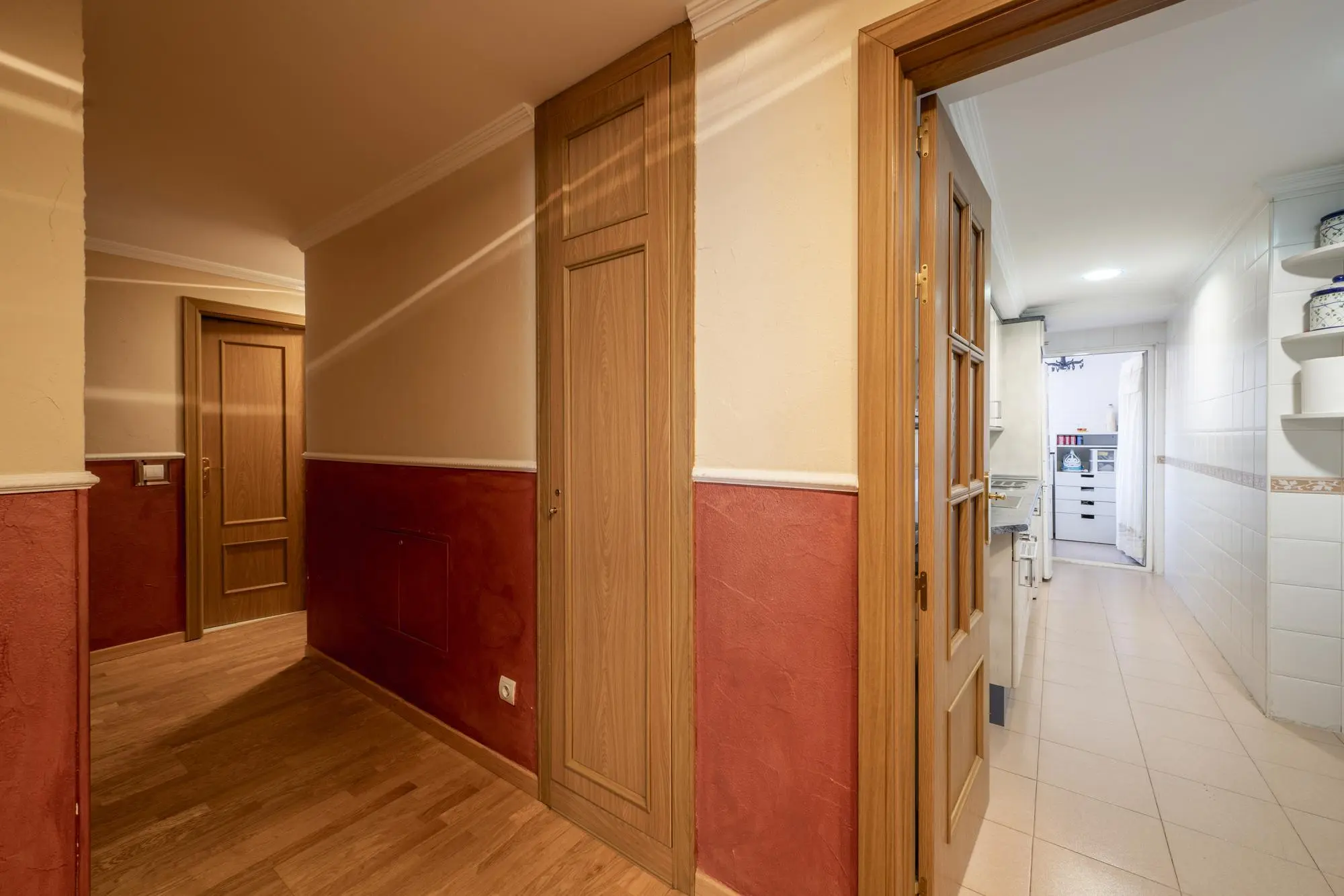 Hallway showing straight alignment toward the front door