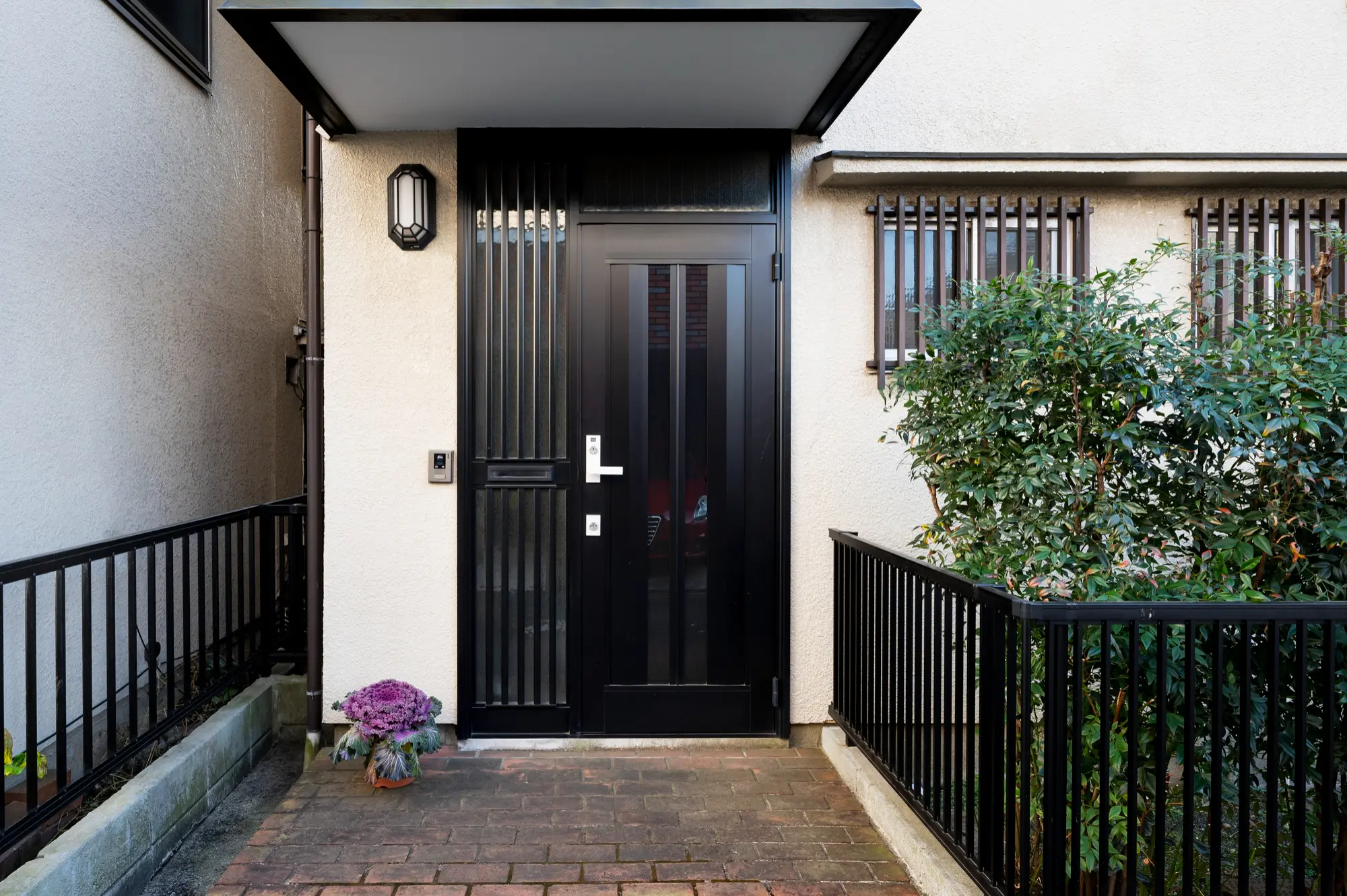 Modern front door with clean clutter free entry path