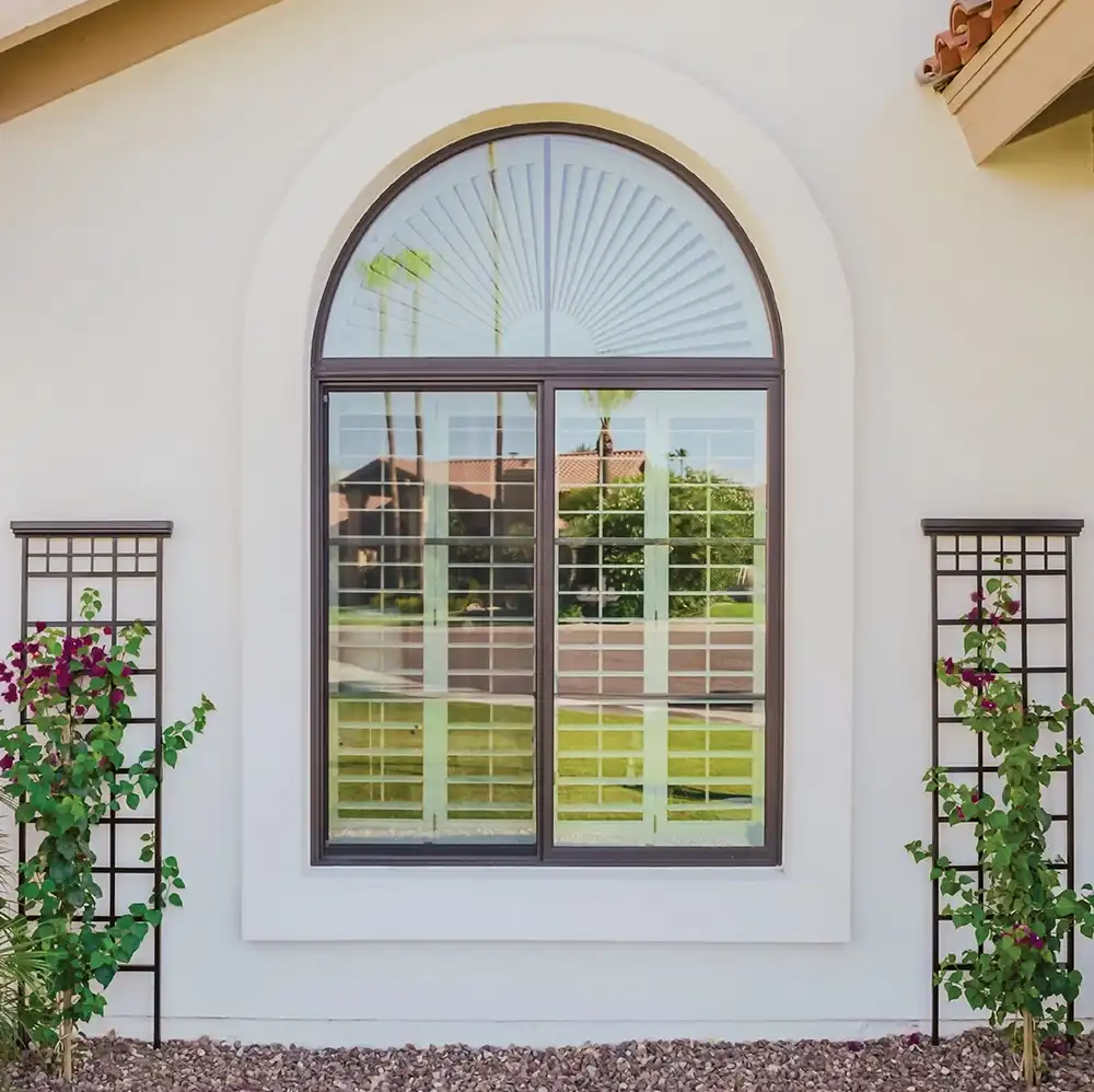 Round top arched window with shutters on exterior wall