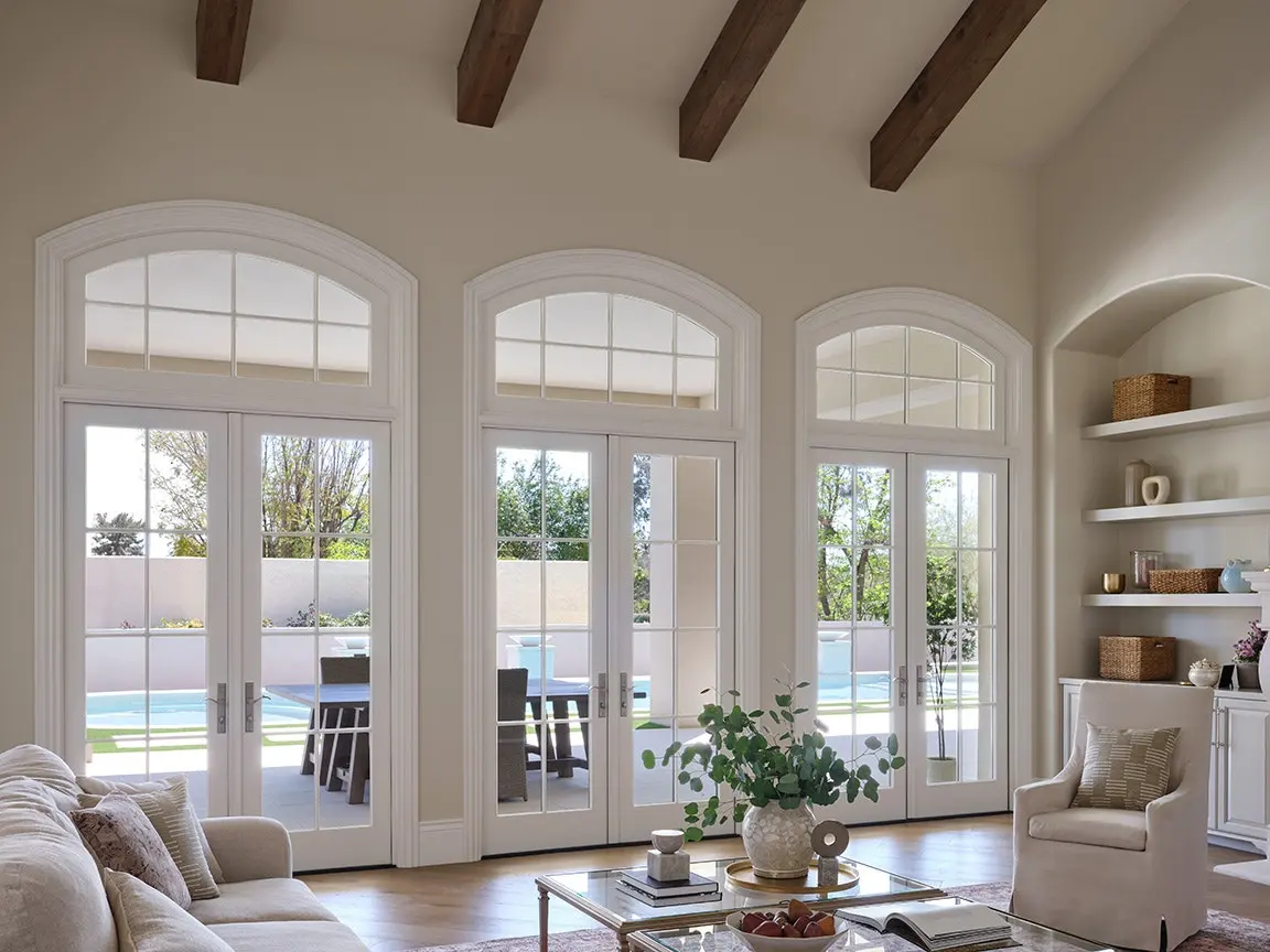Transom Arched Windows Arched transom windows above patio door set