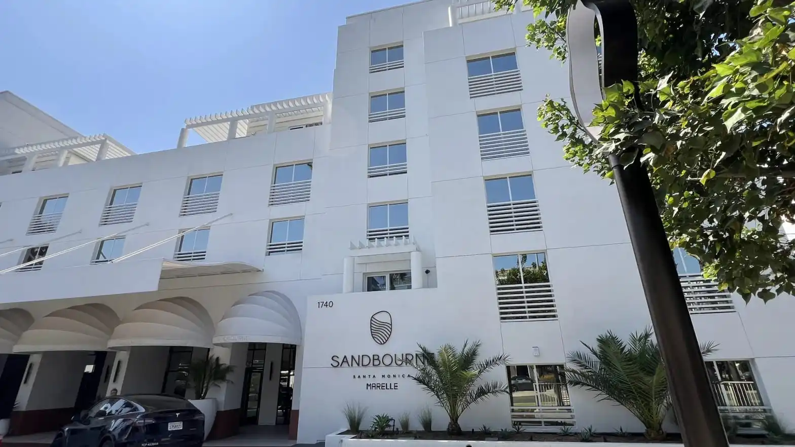 Arrival canopy and contemporary exterior facade of Sandbourne Santa Monica hotel