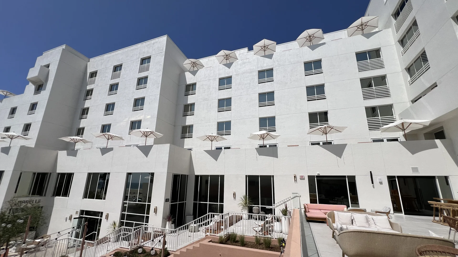 Completed guestroom facade showcasing acoustic insulated 6+24A+6 Low-E glazing units