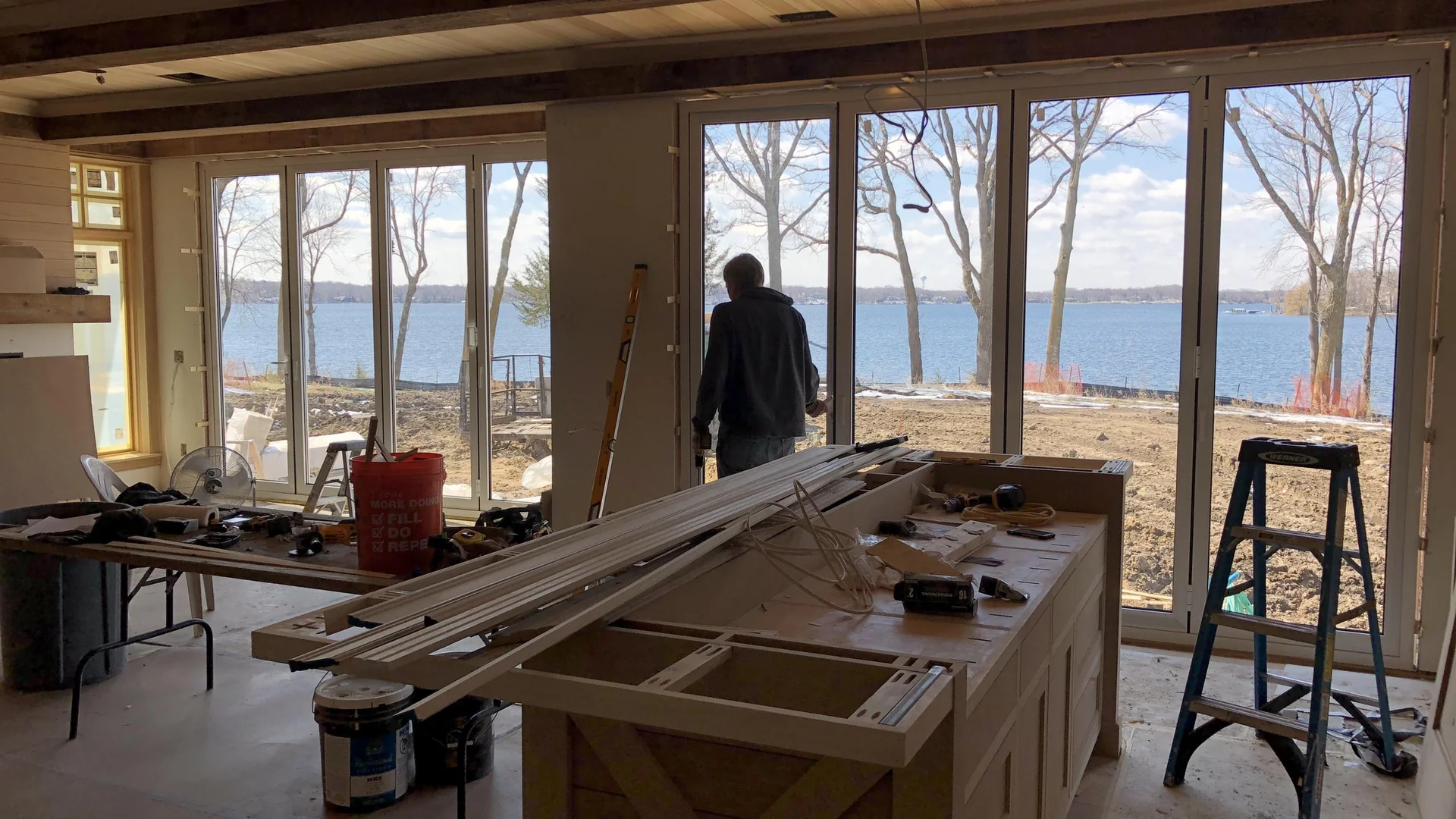 Interior view of Minnesota residence showing integrated multi-unit folding doors and high-performance custom architectural glazing