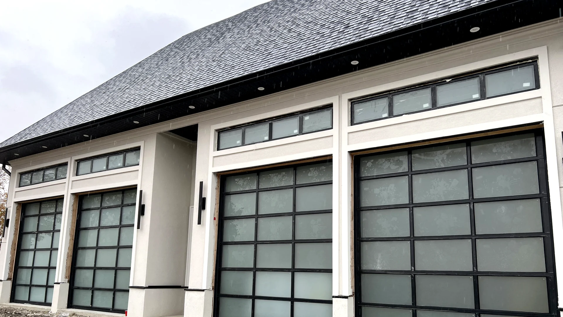 Triple full-view insulated frosted glass garage doors engineered for Bolton Ontario residential estate