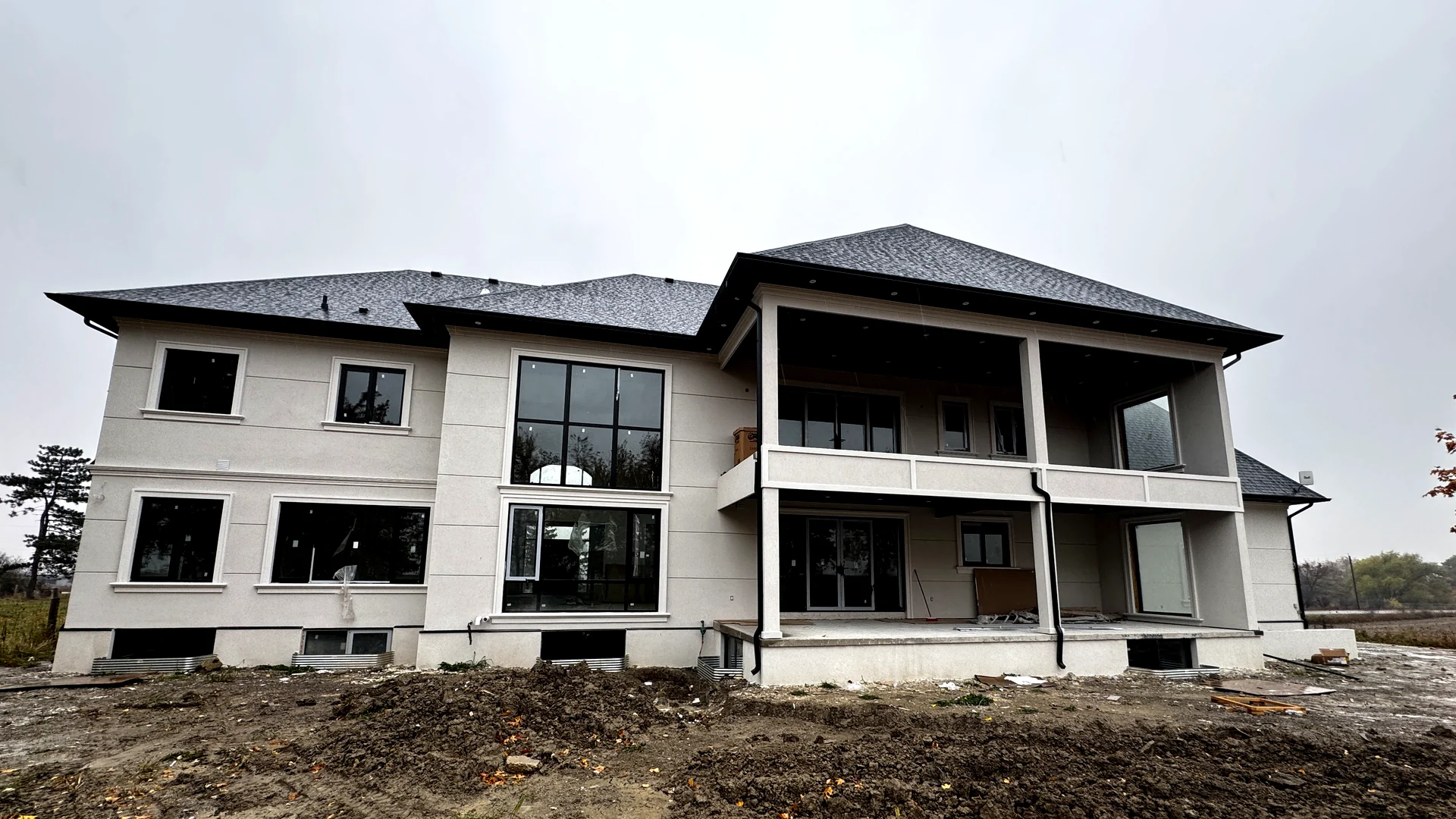 Rear facade covered patio with multi-panel heavy-duty sliding doors