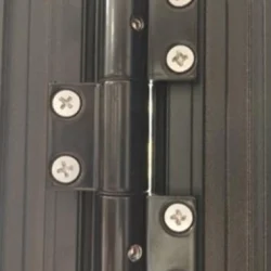Close up of black Bi Fold Door hinge secured with screws