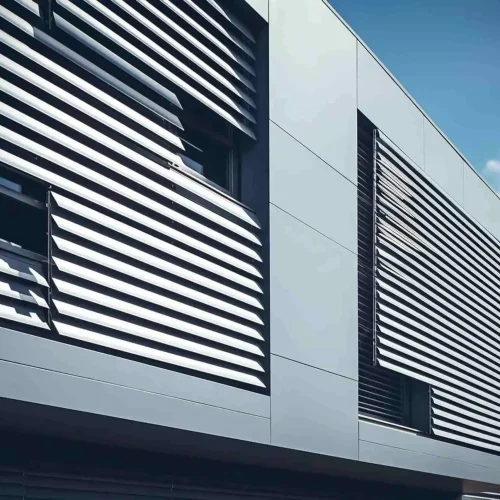 Facade with angled louver slats and windows for ventilation