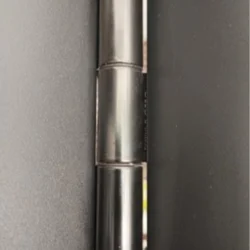 Side view of a black Bi Fold Door hinge on a metal frame